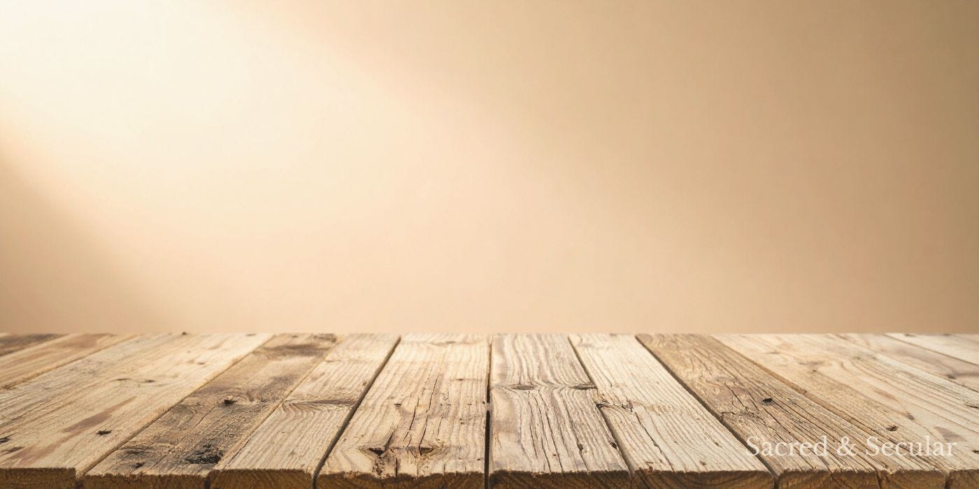 A simple empty wooden table in soft natural light, with shadows falling across its surface, creating a quiet and reflective atmosphere. A simple empty wooden table in soft natural light, with shadows falling across its surface, creating a quiet and reflective atmosphere.