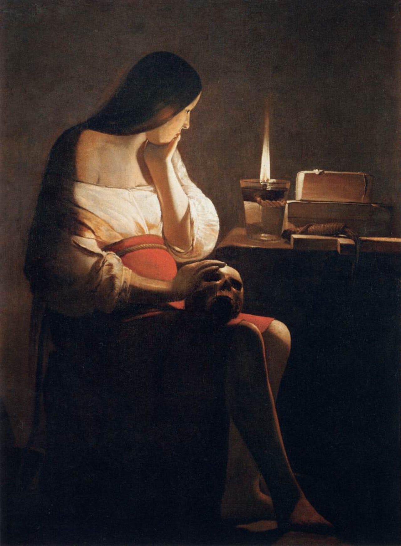 La Tour's Magdalen seated beside a skull and a single candle flame La Tour's Magdalen seated beside a skull and a single candle flame
