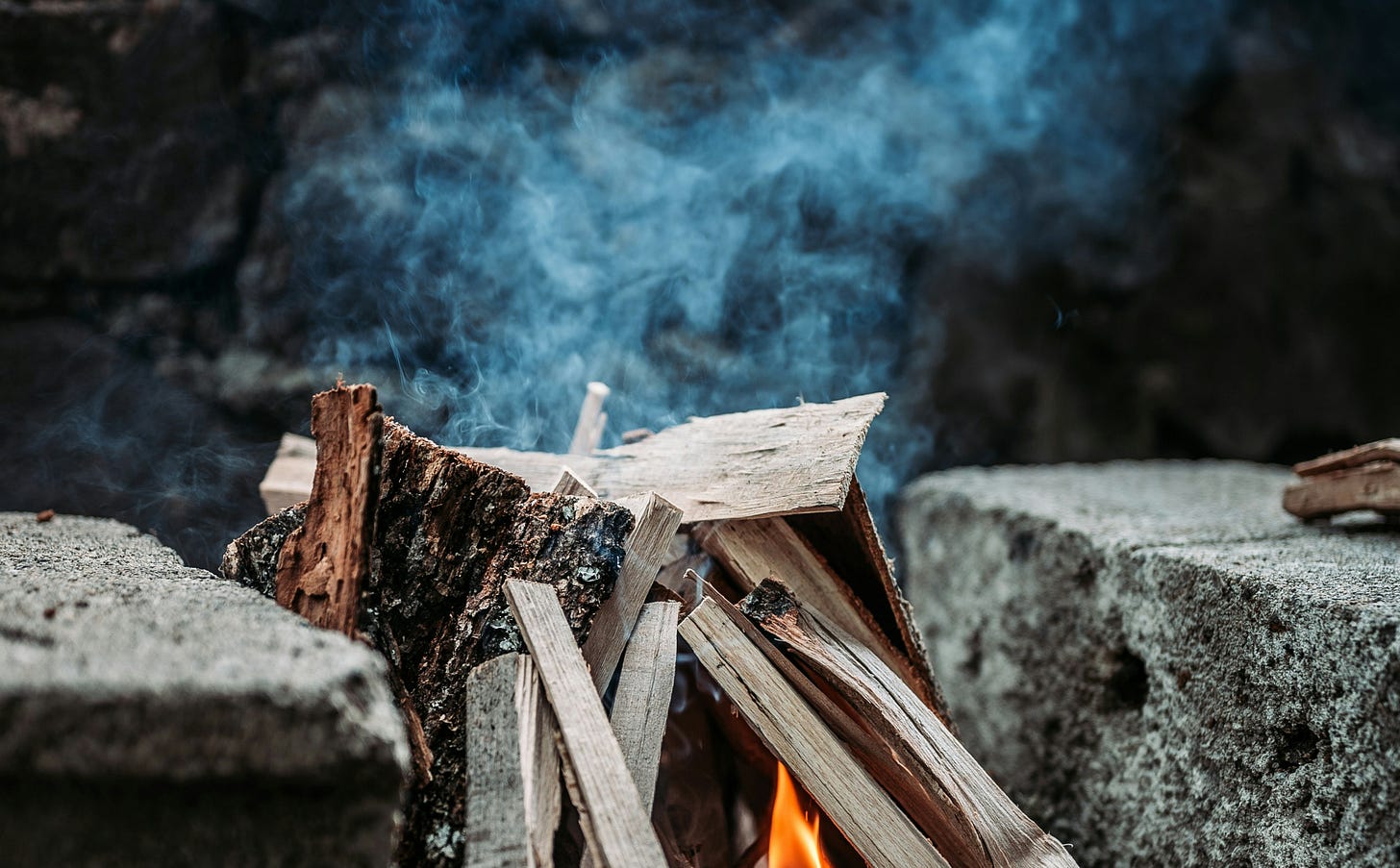 stack of wood starting to smoke