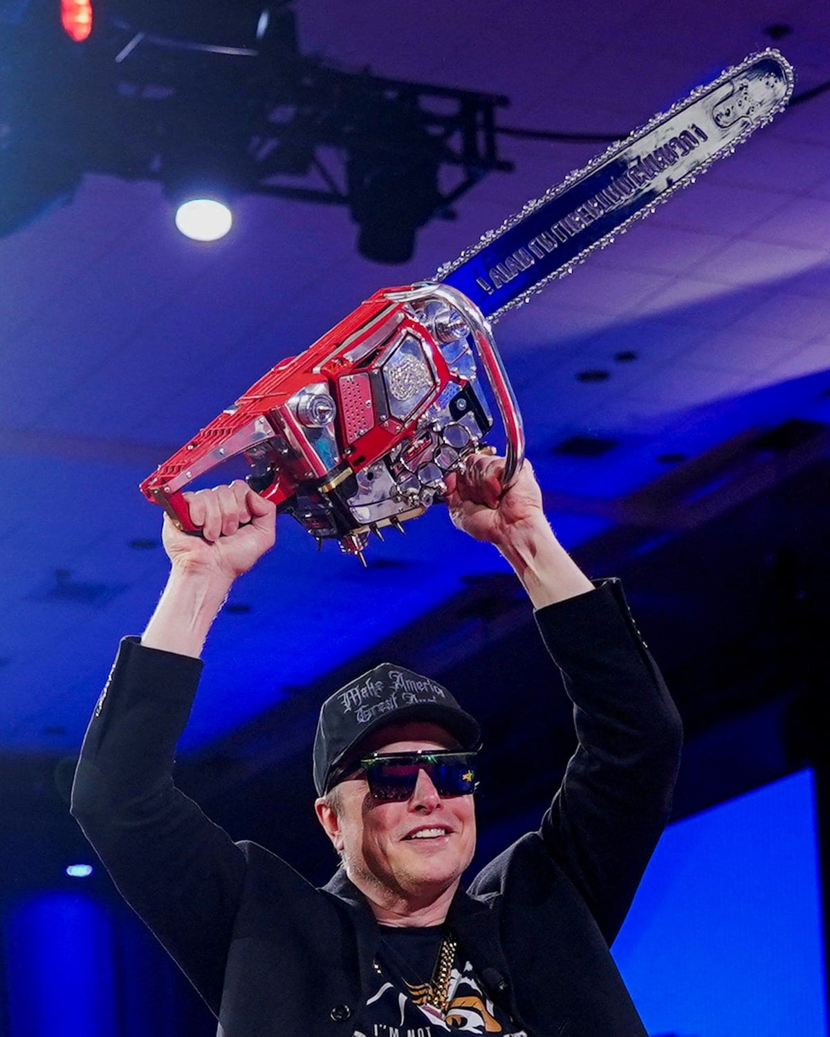 Elon Musk wields chainsaw at conservative gathering, a gift from  Argentina's Milei | Reuters