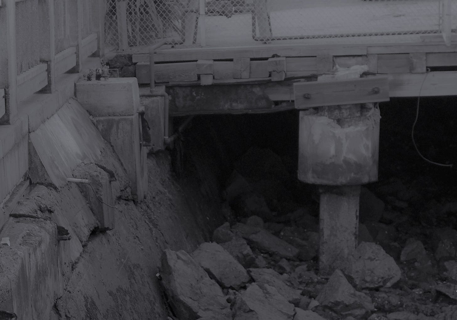 Exposed rocks at low tide beneath Murkey's Diner