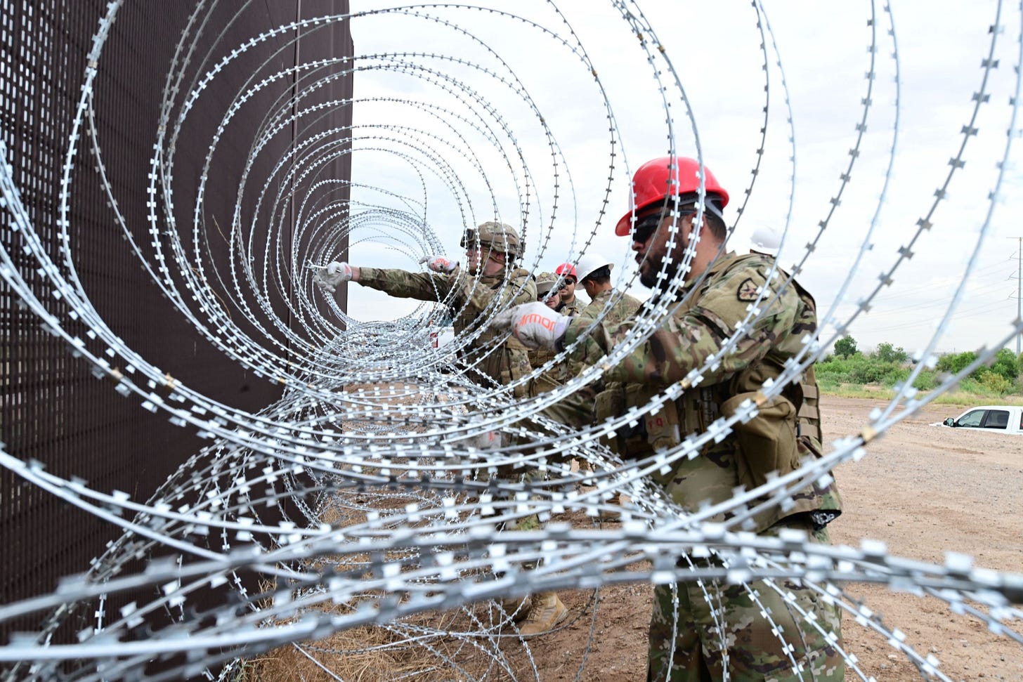 Engineer soldiers assigned to "Operation Lone Star" have installed many miles of solid and concertina wire barriers along the Rio Grande.