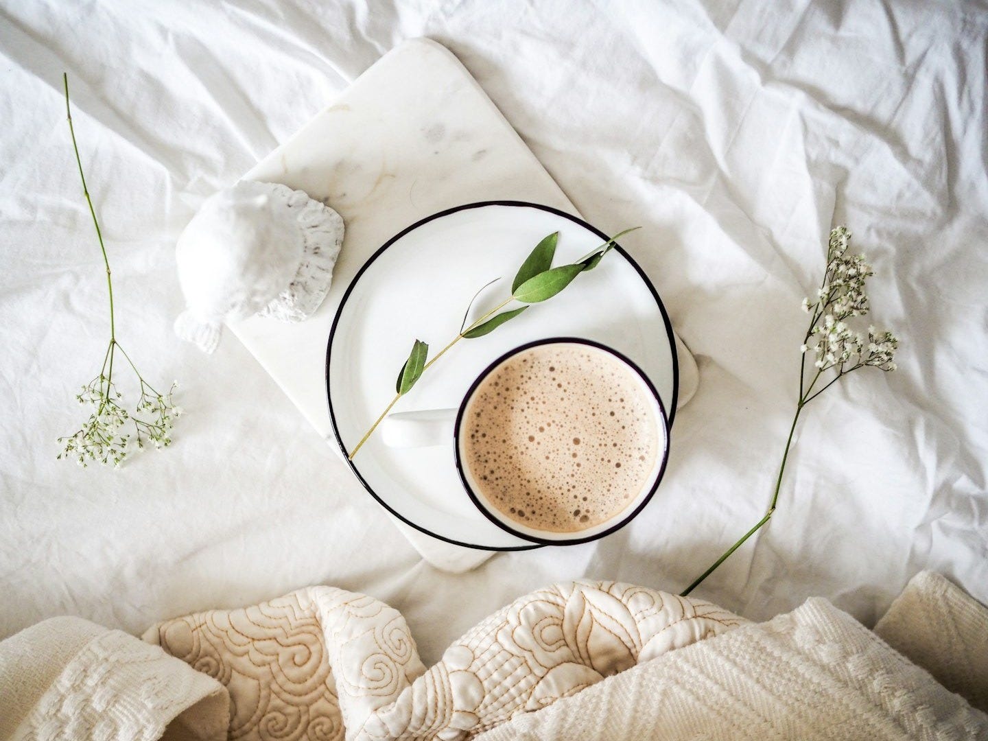 white teacup filled with coffee