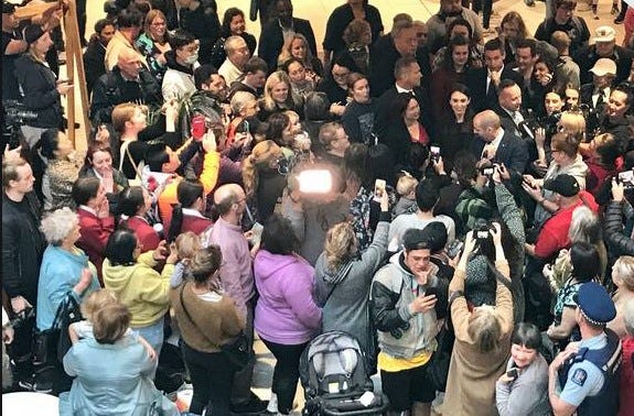 Jacinda Ardern and a crowd of people in a shopping mall. Jacinda Ardern and a crowd of people in a shopping mall.