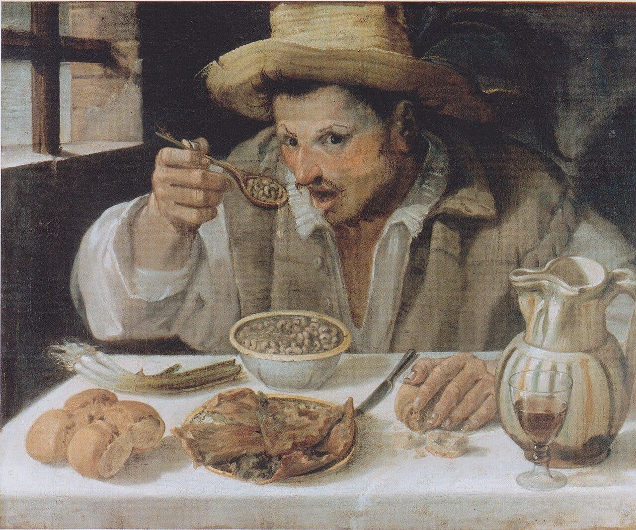 Peasant eating beans spoon