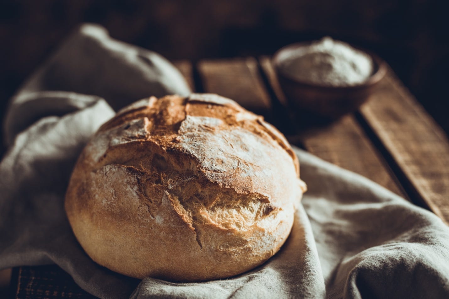 A loaf of bread on a towel

Description automatically generated