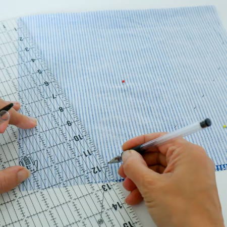 marking a circle on a piece of cotton fabric marking a circle on a piece of cotton fabric