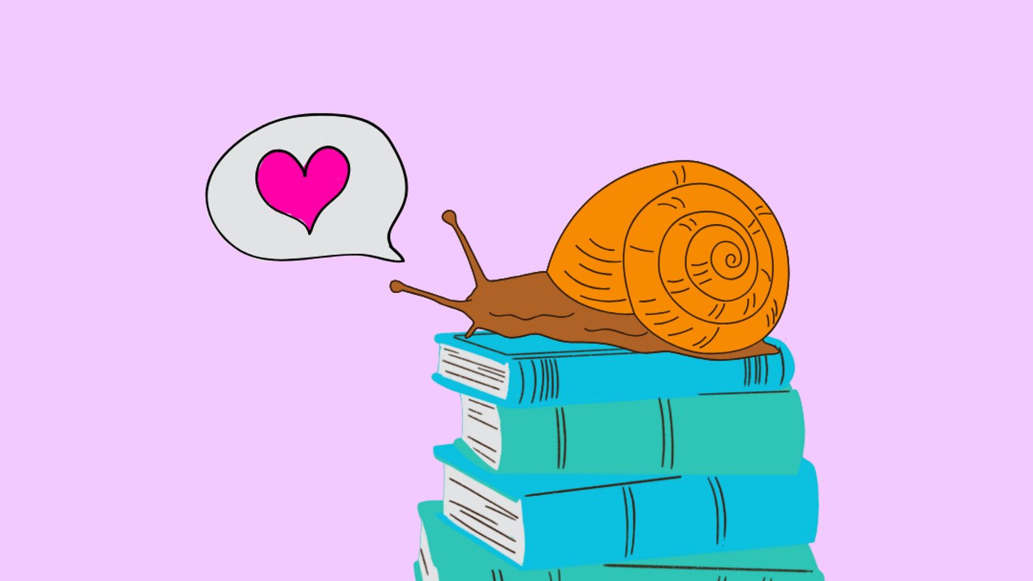 a snail sitting on a pile of her favourite books