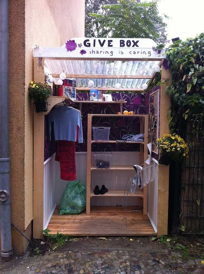 This may contain: an outside view of a clothing store with clothes hanging on the rack and other items This may contain: an outside view of a clothing store with clothes hanging on the rack and other items