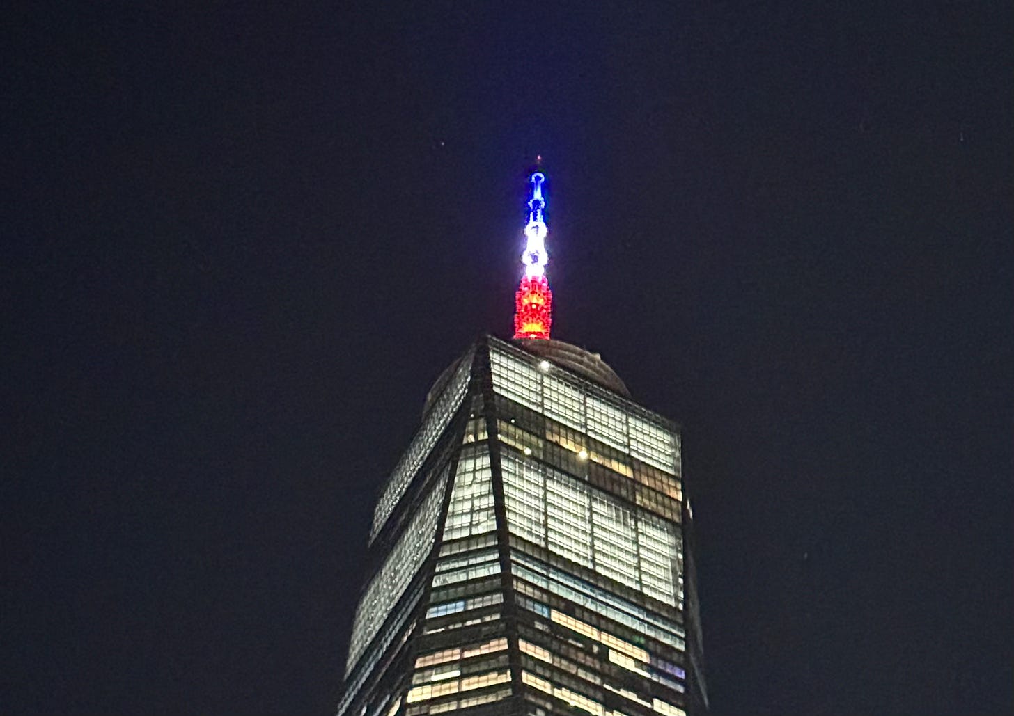 New World Trade Center with antenna illuminated in red, white & blue