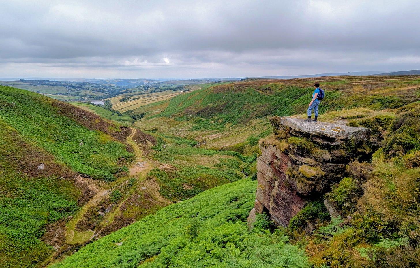 stream valley, crag at its top