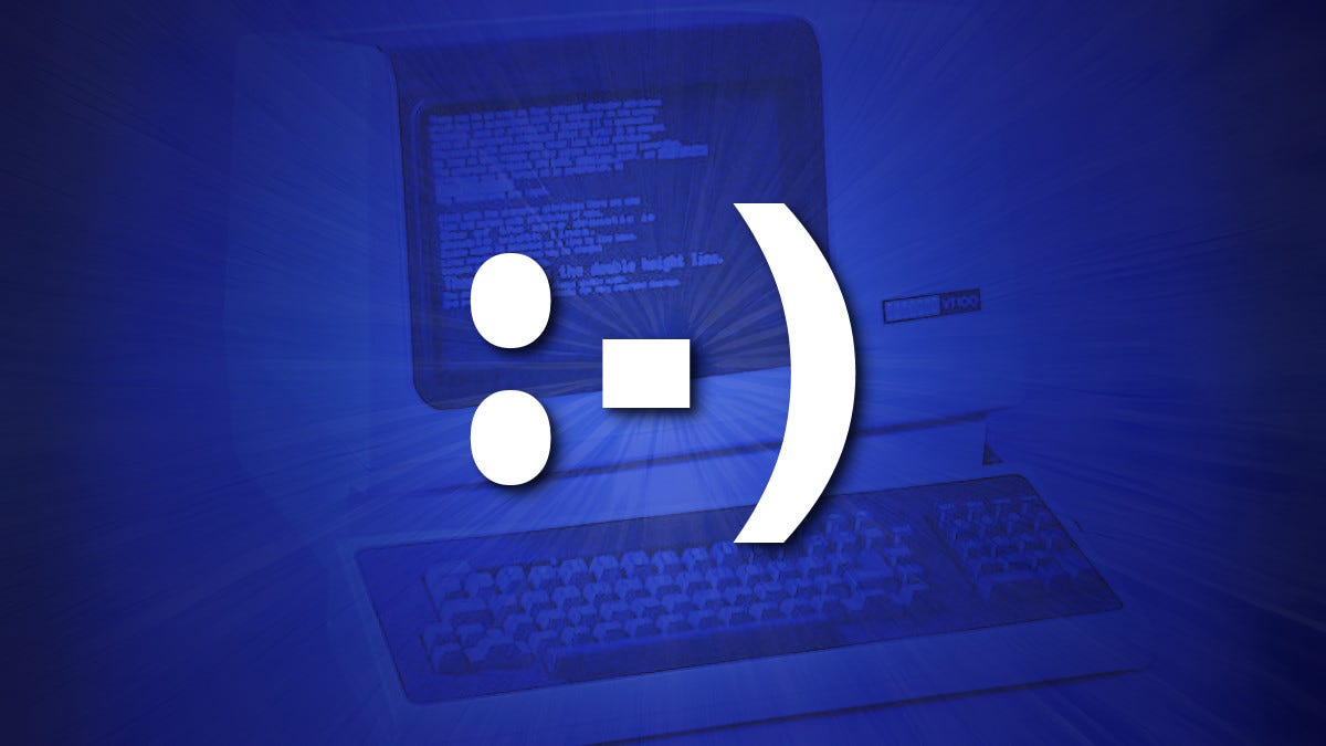 An emoticon on top of a DEC VT-100 terminal in blue.