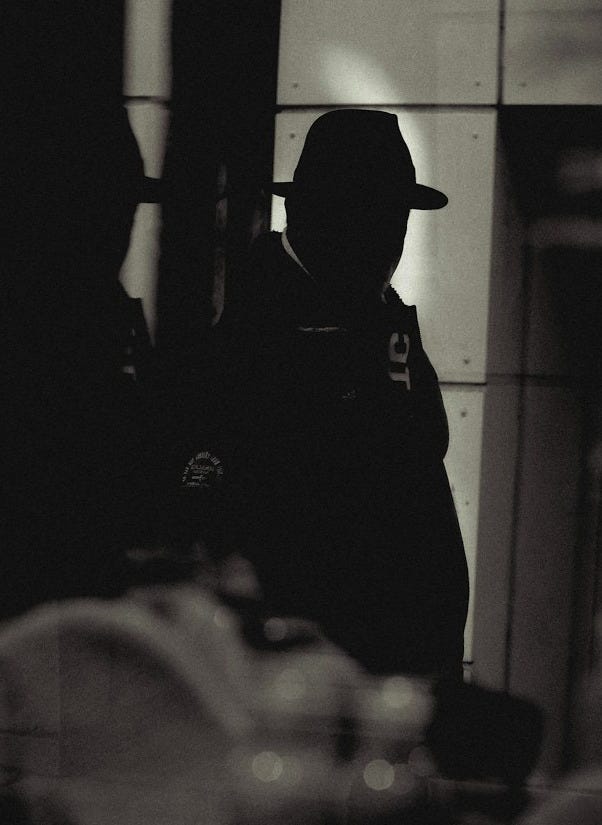 a man standing in front of a mirror in a room