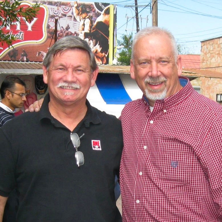Image of two men smiling at the camera in Mexico.