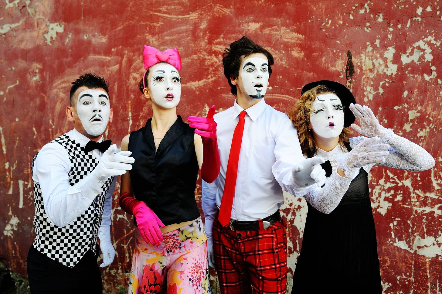 Four people in clown makeup