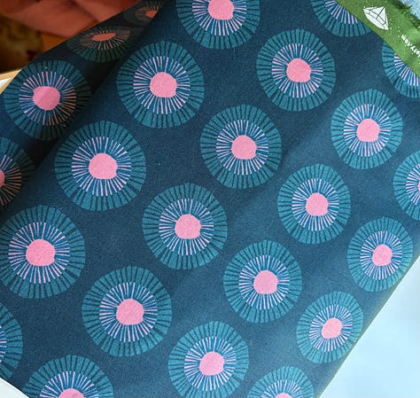 pictures of fabrics, far left is an assembled hexagon quilt with fussy-cut hexagons cut from the fabric on the right