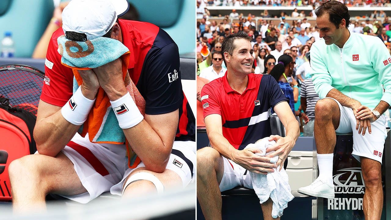 Roger Federer checking on John Isner injury after beating him at 2019 Miami Open. Roger Federer checking on John Isner injury after beating him at 2019 Miami Open.