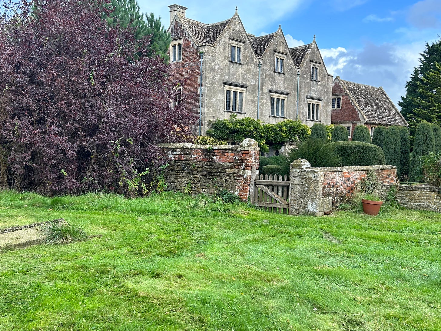 The Manor House, Steeple Ashton as seen from one corner oof the churchyard. The house has its own wooden gate in the wall for access.  Image: Roland's Travels