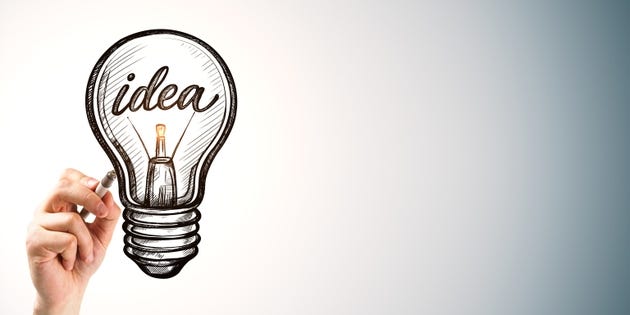 Hand drawing of a lightbulb with idea lettering for creative business innovation and technology concept on clean copy space background template design. Hand drawing of a lightbulb with idea lettering for creative business innovation and technology concept on clean copy space background template design.