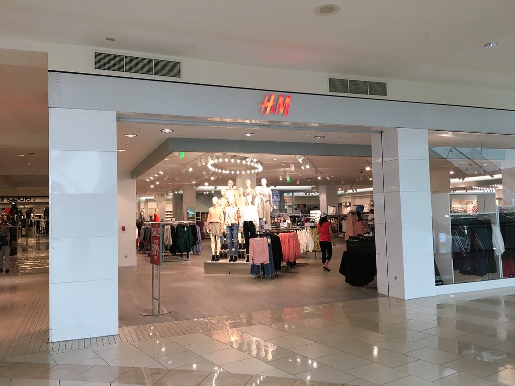 The entrance of an H&M store inside a shopping mall. The entrance of an H&M store inside a shopping mall.