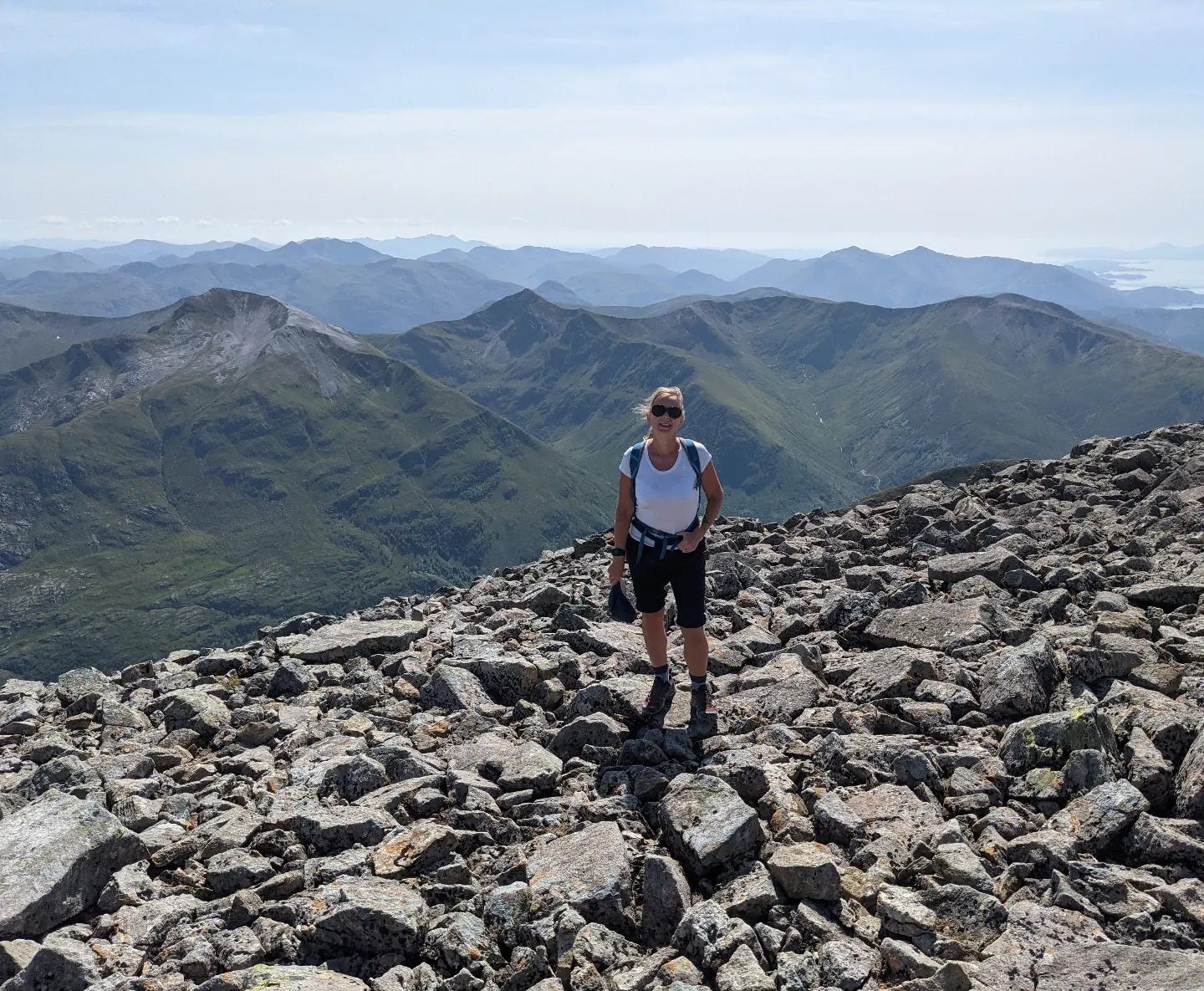 Photo of Andrea on the top of Ben Nevis, after doing the hike there in July 2021.