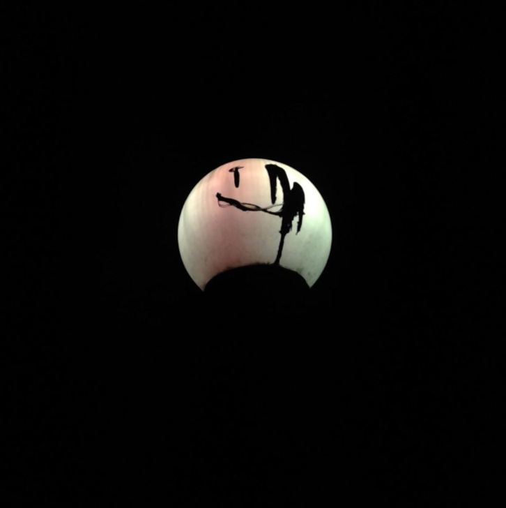 Cover art for the EP I Promise to be Good is a mostly black square with a circular, fish-eye lens perspective of an empty room with a single microphone and stand in the middle. 