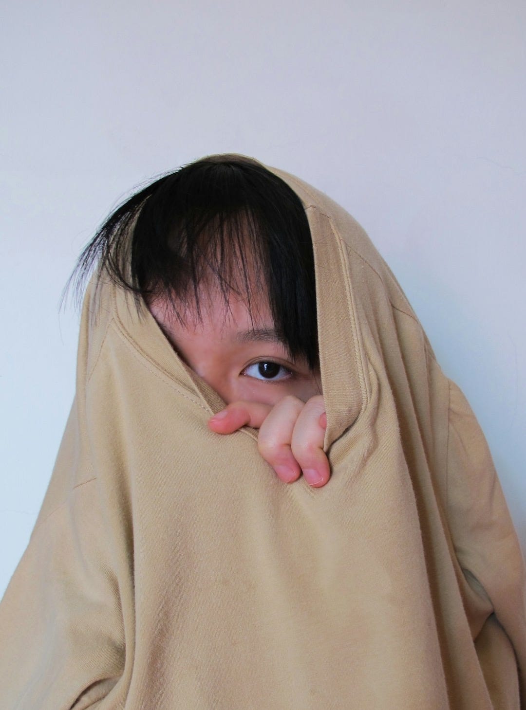 girl in brown long sleeve shirt