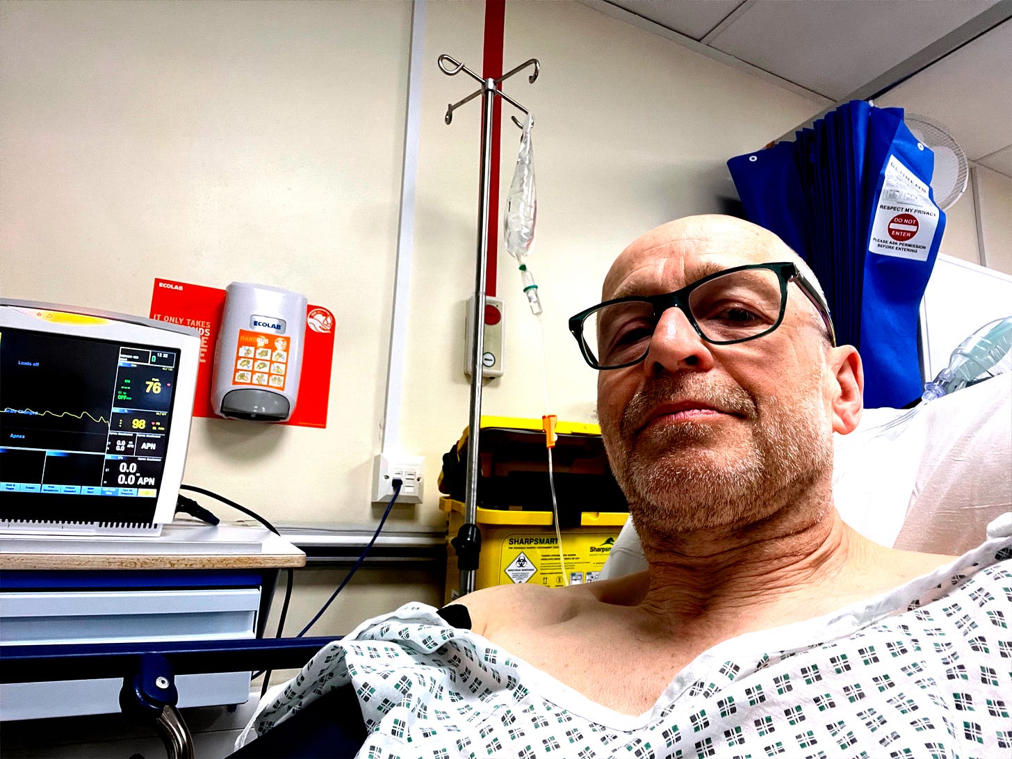 Selfie of Adrian in recovery area recently with drip and heart monitor