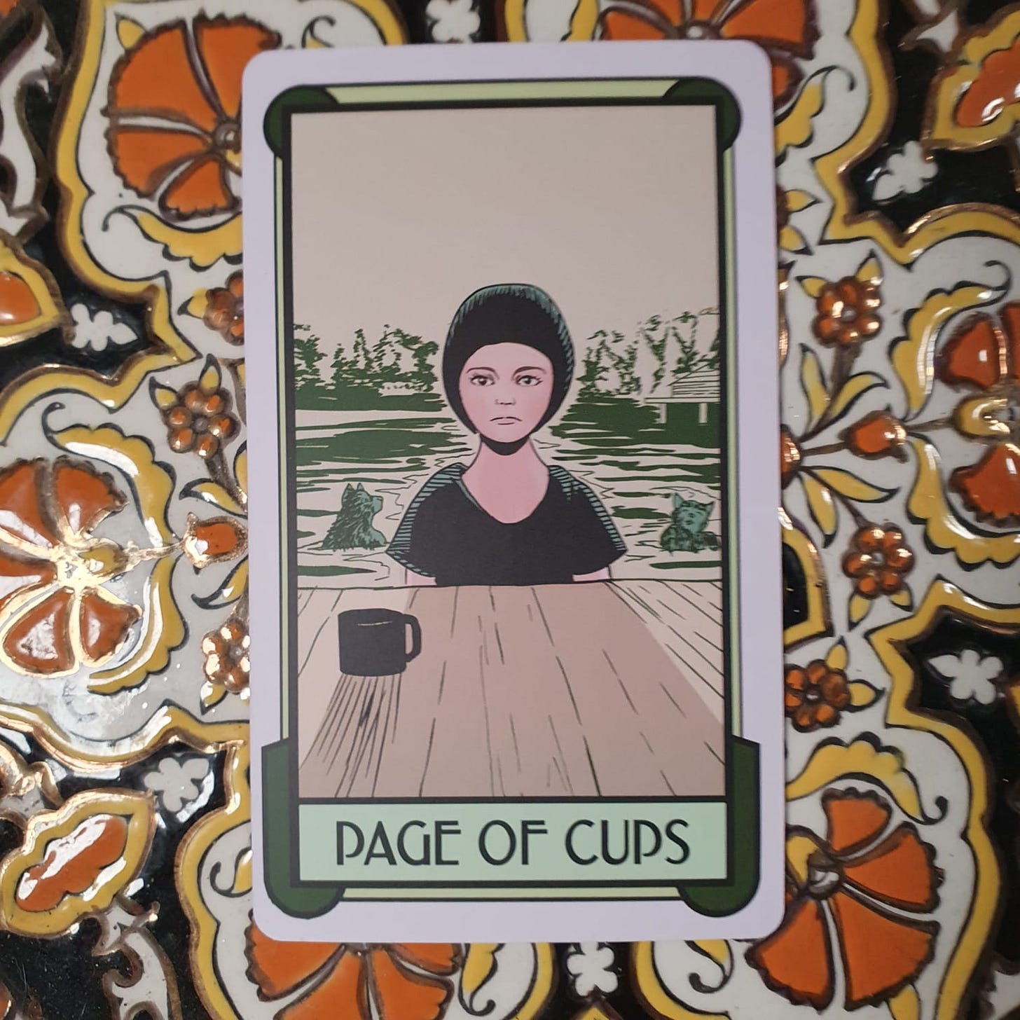 The Page of Cups from the Cat Full Of Spiders Tarot