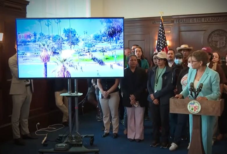 A group of people standing in front of a large screen

AI-generated content may be incorrect.