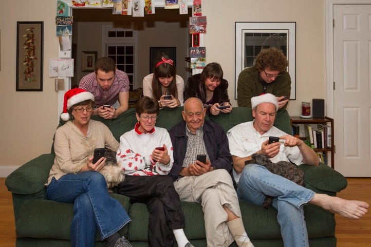 A group of people sitting on a couch using their phones

AI-generated content may be incorrect.