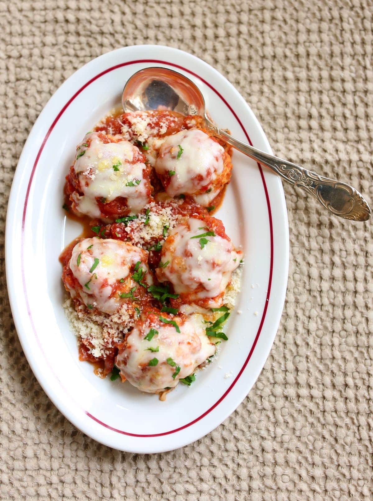 a white plate with meatballs on it.