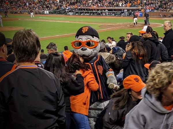 Giants mascot Lou Seal pays my mom and me a visit at the game. Giants mascot Lou Seal pays my mom and me a visit at the game.