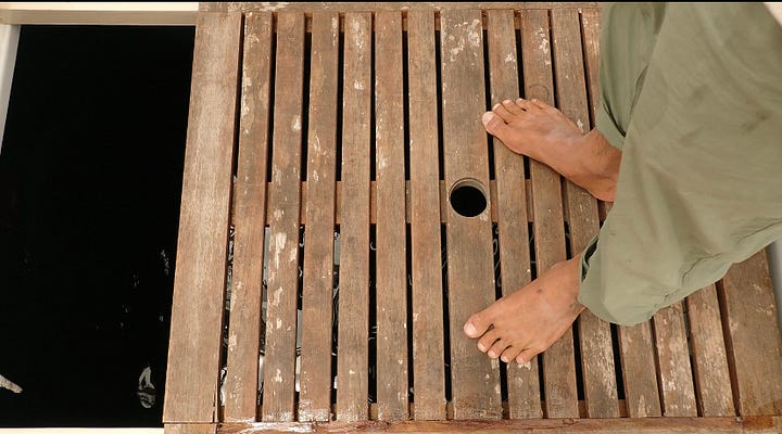 Working on the lashing for the back of the canoe on the water, using a trigger gun to apply quick dry marine crack repair to exposed wood on the boat, chris eating in n out with a big smile, our teak wood center board in place on ʻAʻĀ