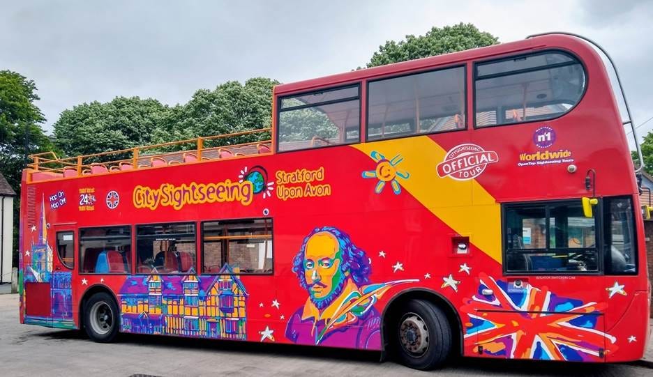 A red double decker bus with colorful designs on it
AI-generated content may be incorrect. A red double decker bus with colorful designs on it
AI-generated content may be incorrect.