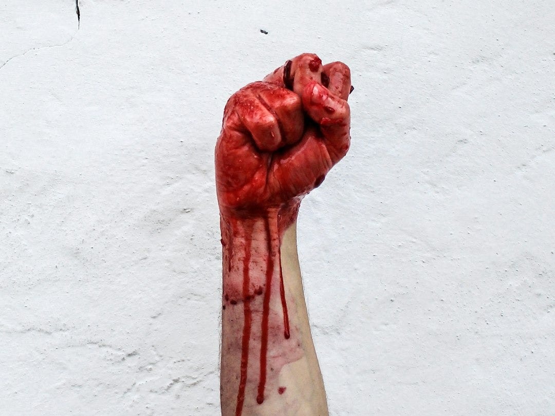 person raishing his hand