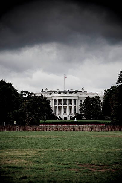 Photo illustration of storm clouds gathering over the White House