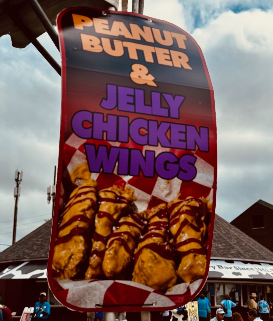 A sign with a picture of chicken wings

Description automatically generated