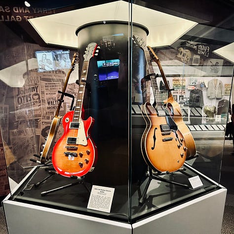 exhibits, display, guitars, case, signs