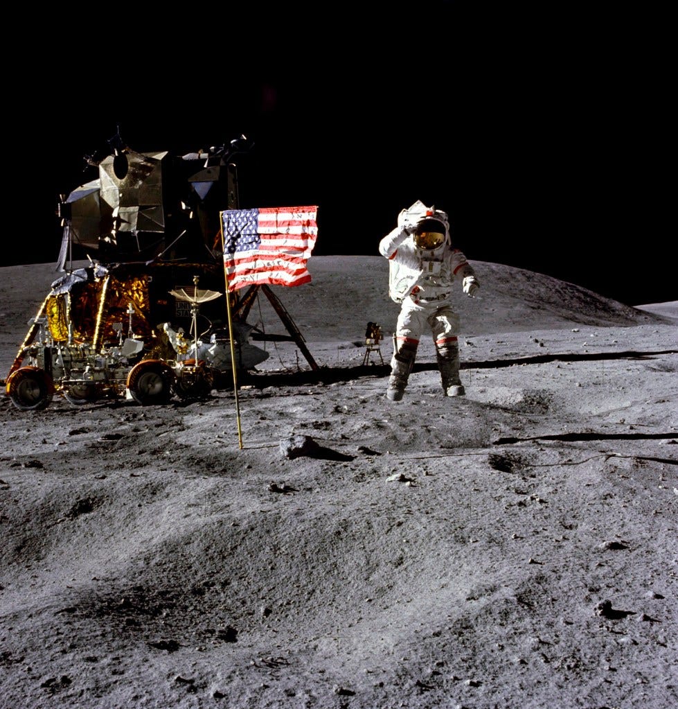 In this April 1972 photo provided by NASA, astronaut John Young salutes the U.S. flag at the Descartes landing site on the moon during the first Apollo 16 extravehicular activity