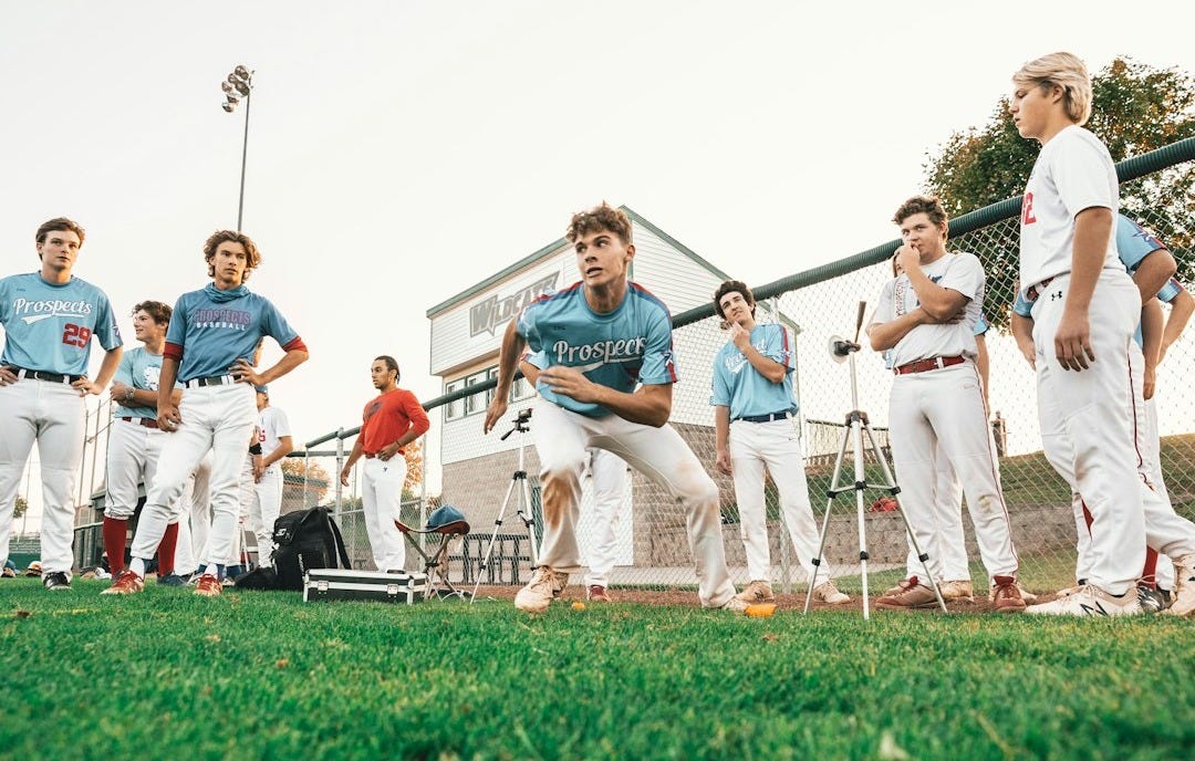 group of people standing on green grass field during daytime