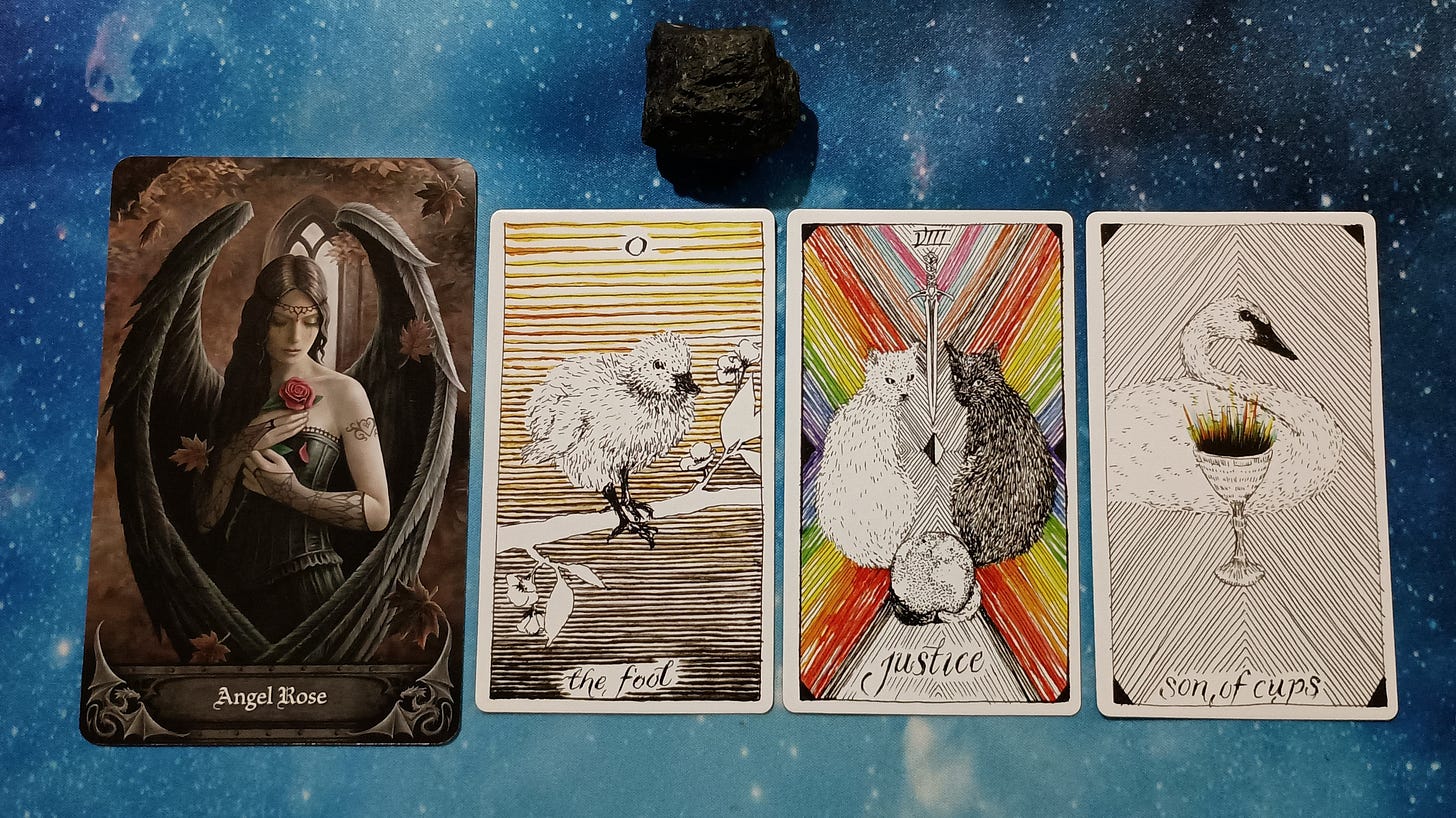 Full Moon Magic: Your August 2025 Pick-a-Card Tarot Reading, Pile 3, Black Tourmaline crystal and 4 cards, face up Full Moon Magic: Your August 2025 Pick-a-Card Tarot Reading, Pile 3, Black Tourmaline crystal and 4 cards, face up