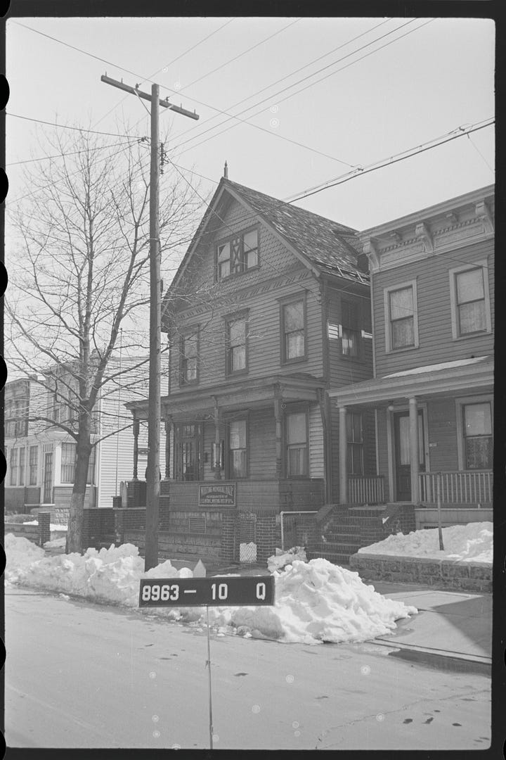 Images show a photograph of Whiting Memorial Hall and a detail showing an enlarged image of the sign on the building.