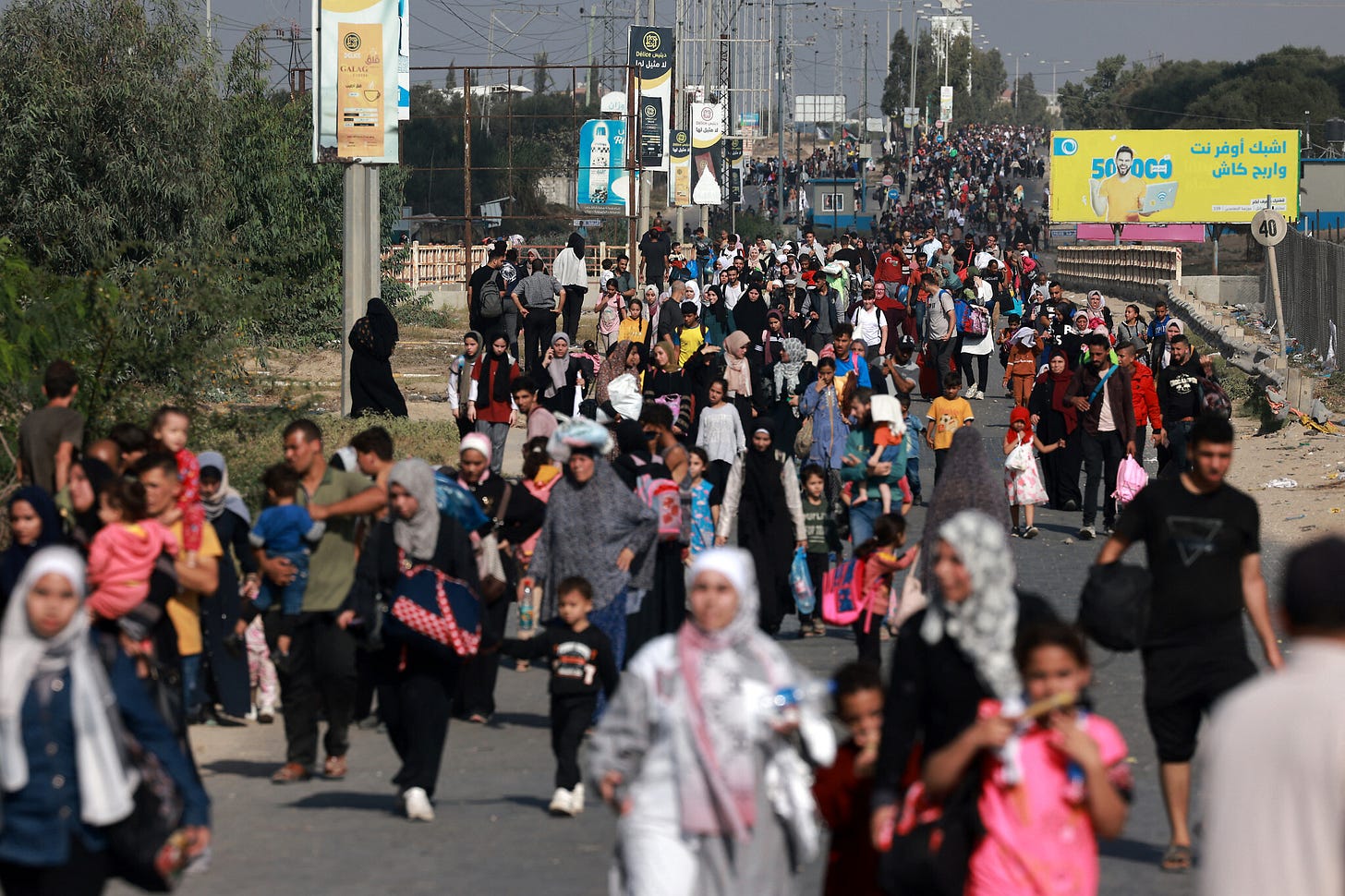 Thousands of Gazans use humanitarian corridor to move south as IDF presses  offensive | The Times of Israel