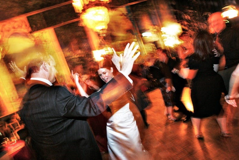 dana dubois dancing with stepfather at wedding blurry image
