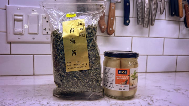 The first photo in the gallery shows a large bag of nori flakes on a counter beside a stout glass jar of whole hearts of palm. The second photo shows two king oyster mushrooms standing next to each other on a countertop.