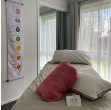 Woman at oceanside, logo, reiki room
