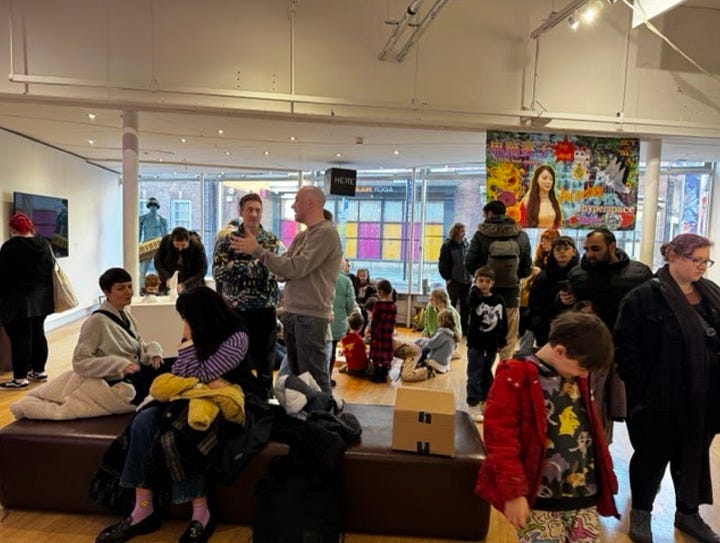 young people and families taking part in making robots out of cardboard boxes