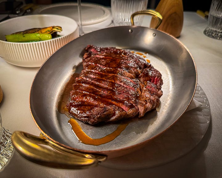 A selection of dishes from Loren: Truffle Pizza, Woodfire Grilled Ribeye Steak and a pear cheesecake with a dark chocolate souffle.