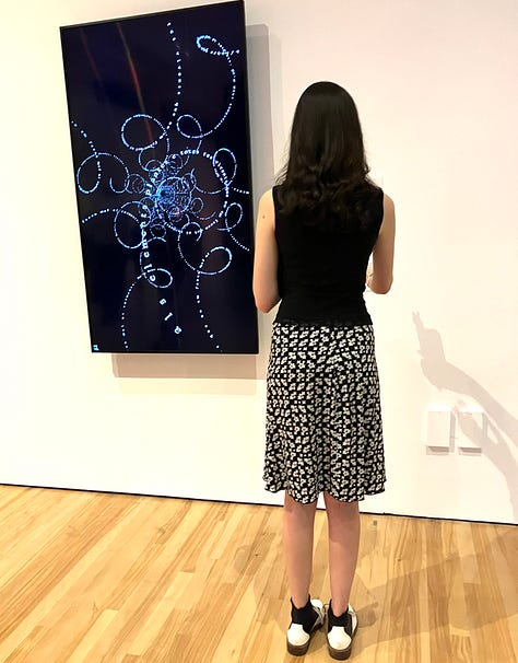 Visitor interacting with the art at the Run the Code exhibit